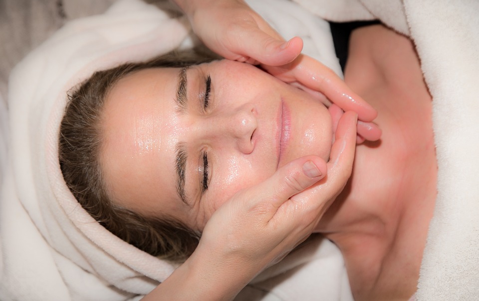 client enjoying the relaxation a facial massage brings