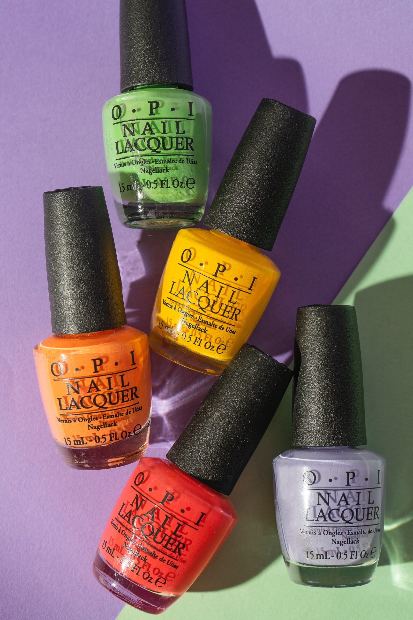 OPI-nail-polish-laid-down-on-a-colorful-background