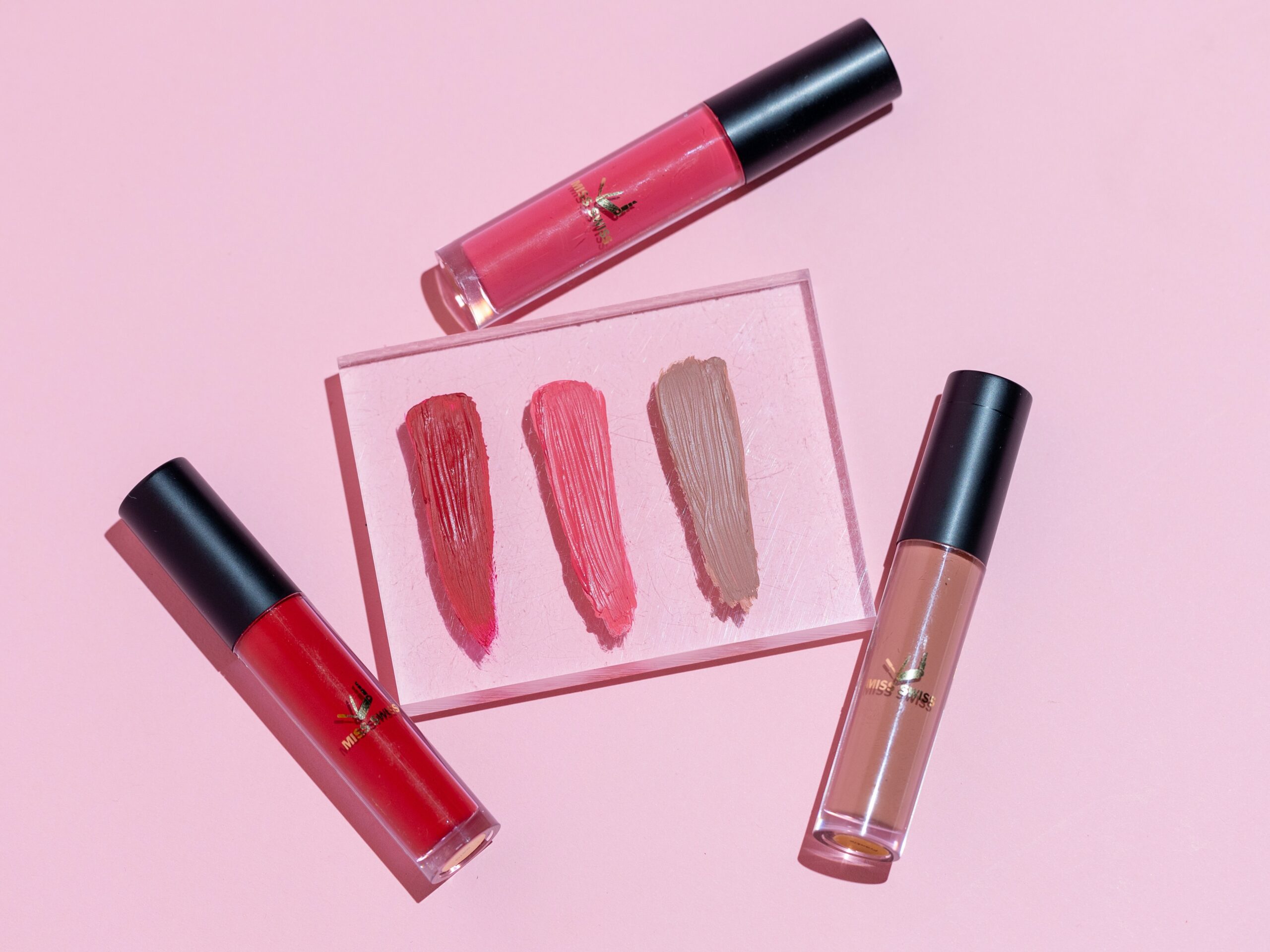 pink-and-black-lipstick-and-make-up-brush